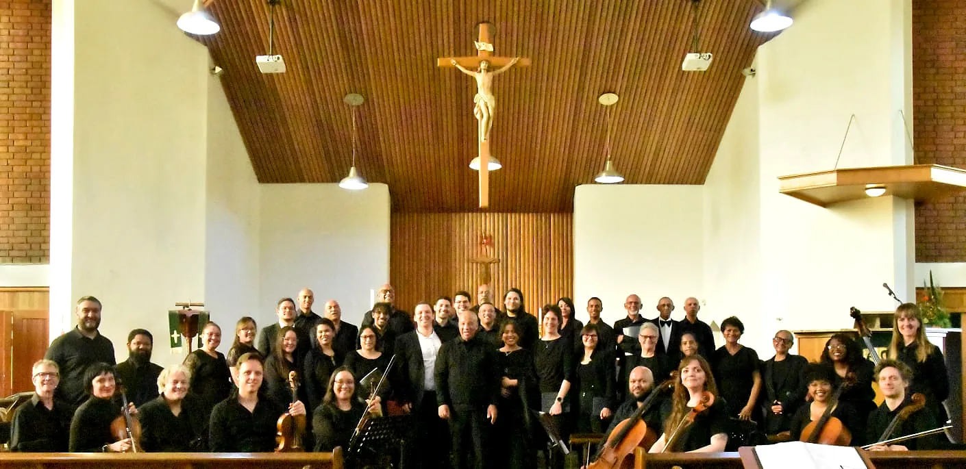 Choir and instrumentalists gathered after a performance